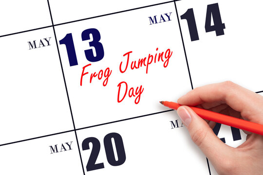 May 13. Hand writing text Frog Jumping Day on calendar date. Save the date. Holiday. Planning or scheduling concept.