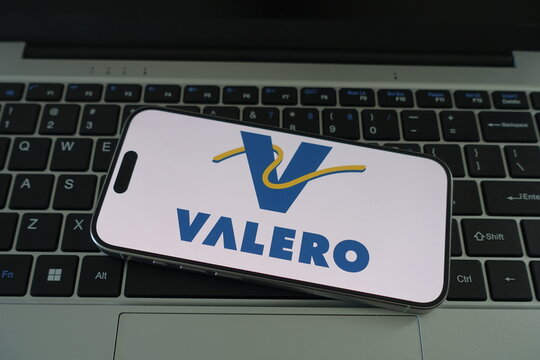 Kiel, SH, Germany, 04-01-2025 Valero Logo Displayed on Smartphone Over Laptop Keyboard, Symbolizing Corporate Identity in Digital Age