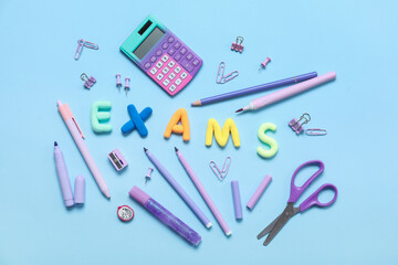 Composition with word EXAMS and different stationery on color background