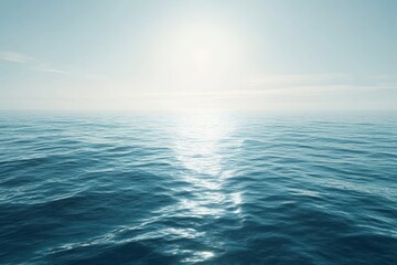 Obraz premium Calm ocean waters reflect sunlight at dawn in a serene coastal landscape