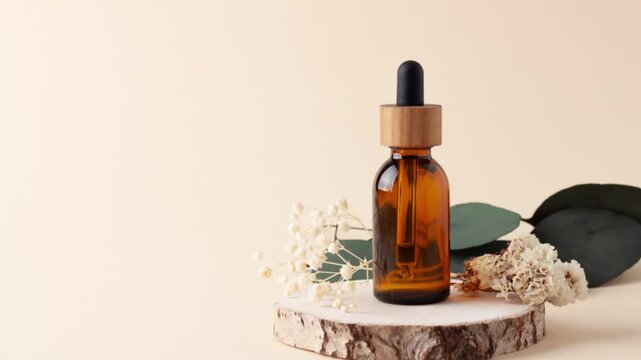 Cosmetic bottle on pastel beige background. Close up, copy space