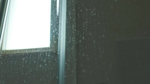 Close-Up of Limescale Buildup on Glass Shower Enclosure