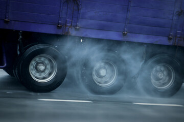 Heavy vehicles moving on wet roads