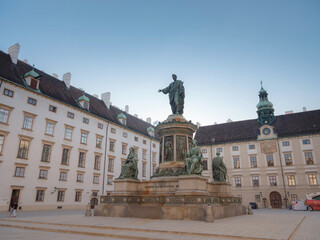 Fototapeta premium Summer trip to Vienna: exploring city beauty. Monument to Emperor Franz I at Hofburg Palace in Vienna, Austria in a beautiful summer day