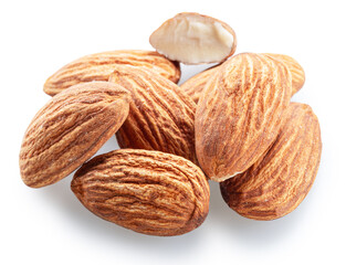 Pile of shelled almond nuts isolated on white background. File contains clipping path.