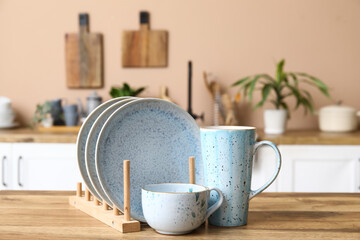 Beautiful clean dishes on table in kitchen, closeup
