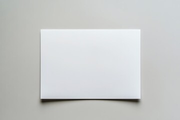 Fototapeta premium Top View White Paper on Gray Surface, Clean Minimalist Background, Flat Lay Design