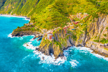 A breathtaking aerial photograph of Manarola, one of the iconic villages of Cinque Terre, Italy,...