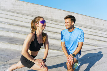 Friends Exercising Together on a Sunny Day at an Outdoor Fitness Area