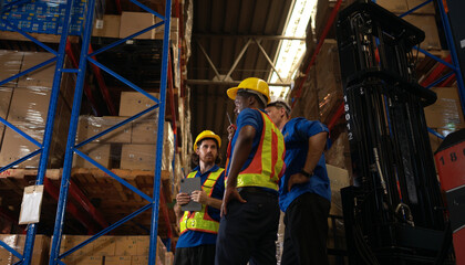 A bunch of warehouse workers are reviewing the list of items based on the documentation