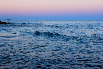 Obraz premium ripples of water, reflection of light on the sea at sunset