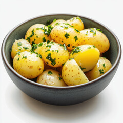 boiled potatoes with parsley in the bowl on a white background