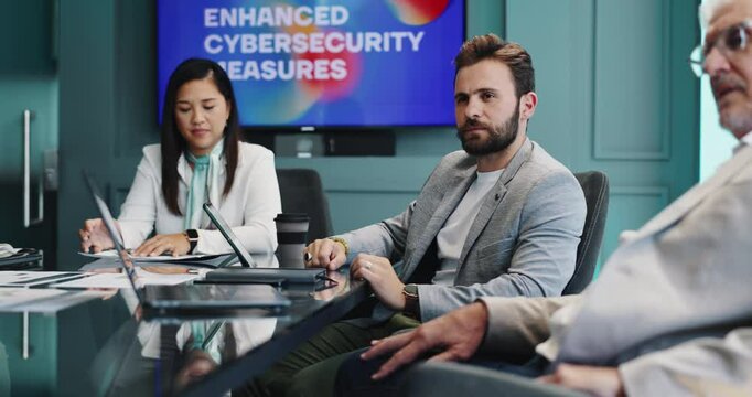 Presentation, meeting and business people in office for cybersecurity training, workshop and info. Professional, corporate and workers with monitor for data protection, digital security and safety