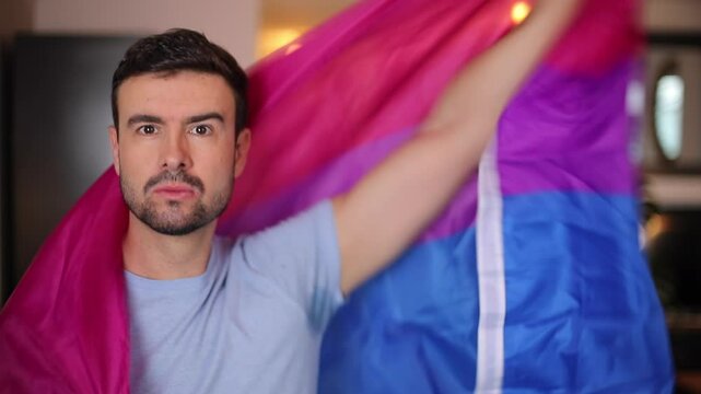 Good Looking Man Waving the Bisexual Pride Flag