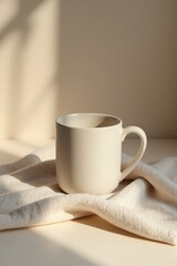 Cozy morning sunlight illuminating beige coffee mug