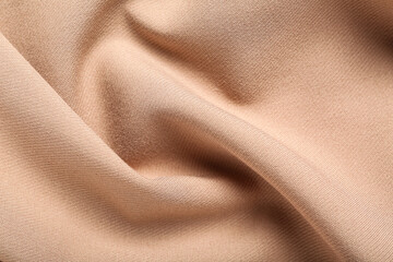Texture of beige fabric as background