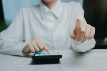 Professional woman using calculator to solve problems, Business concept