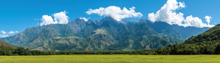 Obraz premium breathtaking mountain range clear blue sky, surrounded by lush green fields and vibrant clouds, evokes sense of tranquility