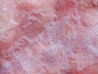 Obraz premium Close-up of Soap bubbles on hands, hand washing