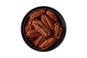 Nut, pecans in a ceramic bowl, an ingredient in vegan food