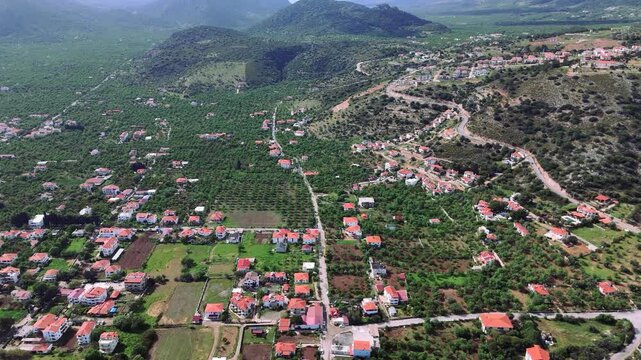 Drone Shot Capturing the Landscape of a Village Nestled Amidst Cultivated Fields and Mountains. Datca, Mugla, Turkey