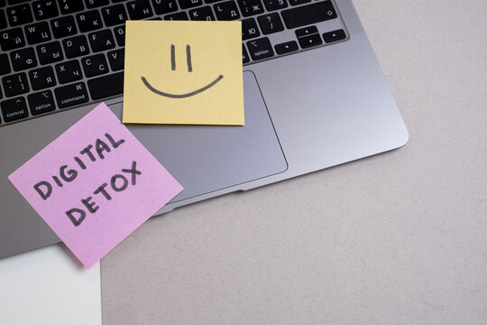 Technology concept - words of digital detox digital gadgets. Concept of social media addiction. Stop using digital gadgets at home and outside of work hours.
