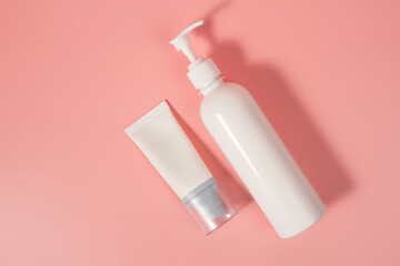 Empty tubes of cream on a pink background. Complex of creams for skin care.