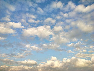 Blue sky with clouds. Cirrocumulus on sunny peaceful day.