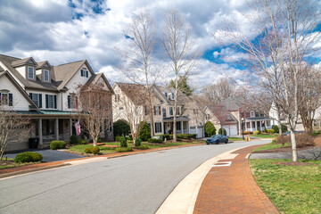 neighborhood of single-family homes with garages and driveways in a Washington, D.C. suburb.