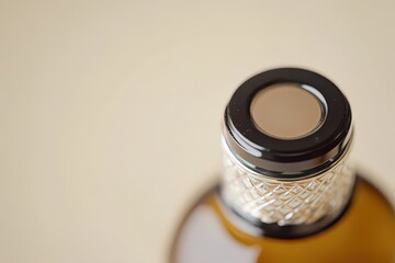 A close up photograph of the top of a bottle