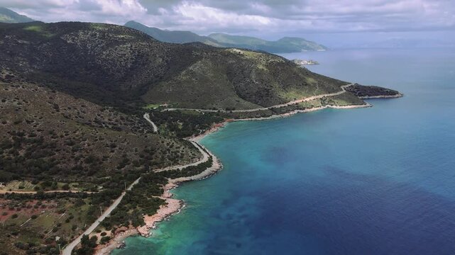 Drone Capturing Palamut Buku Village, Harbor, Mountains, and Aegean Sea in Datca, Mugla, Turkey, on a Beautiful Sunny Day