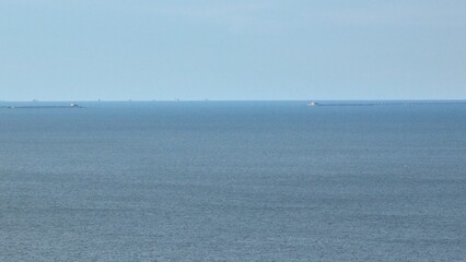 Chesapeake Bay at Virginia Beach, VA showing bridge and tunnel on horizon on a clam peaceful day...