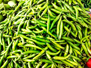 A pile of green chilly open sell in Indian market.