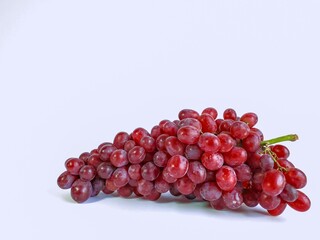 Red grapes on a white background, isolated