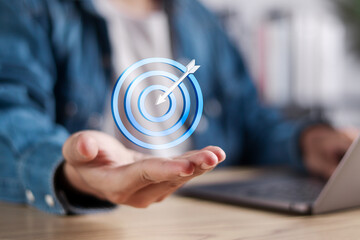 Aiming for winning goal concept. Business strategy, Company target achievement, business goal or objective to achieve. Businessman show virtual target icon for business objective.