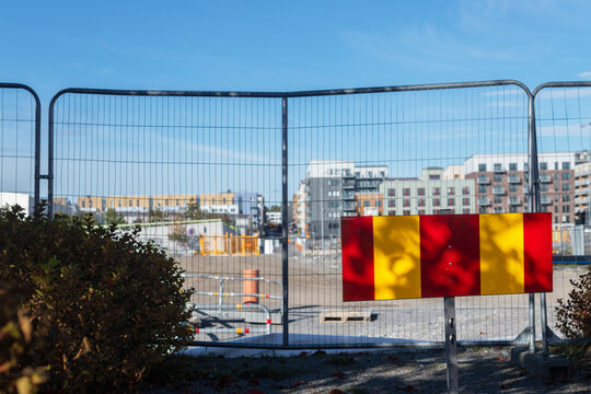 Barriers at roadside against sky in city