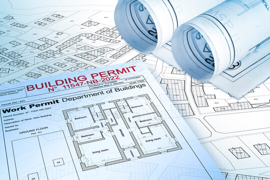 Approved Buildings Permit concept with imaginary cadastral map - building activity and construction industry concept with city map and building work permission