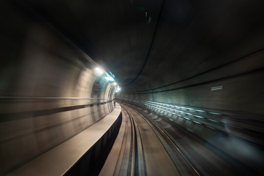 Blurred motion of illuminated underground railway tunnel