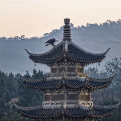 Fototapeta premium Traditional pagoda with a crow perched against a misty backdrop 