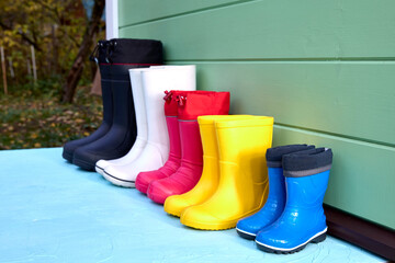 Brightly Colored Rubber Boots Lined Up Outdoors