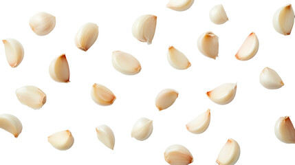 Garlic cloves scattered on black background, cut out transparent