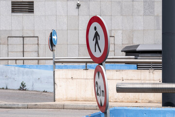 Pedestrian and vehicle restriction signs in city sidewalk area, urban environment and transportation control concept for street law, signage and regulation illustrations