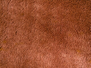 The texture of the soft brown fabric.
