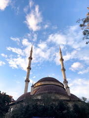 Traditional Mosque With Twin Minarets Against Blue Sky At Sunset, Outdoor Urban Scene, Cultural Heritage Concept, Suitable For Travel, Religion, Architecture, Holidays, Commercial Use © VerraDesigns