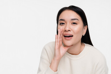 Funny young Asian woman girl in white shirt posing screaming shouting yelling bawls isolated on...