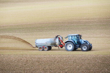 Farmer spreading liquid manure
