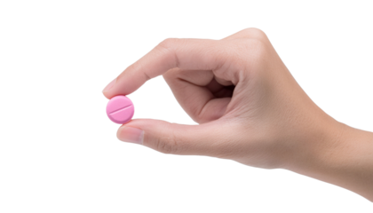 A hand gently holding a pink pill between the fingers. The pill is in focus, with a cross etched into the surface.
