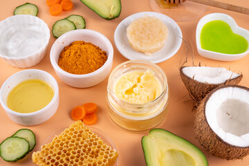 DIY Natural Sunscreen Alternative, Anti-Sunscreen Movement. Natural organic SPF ingredients background with olive oil, coconut oil, cocoa butter, aloe gel, beeswax, carrot seed oil