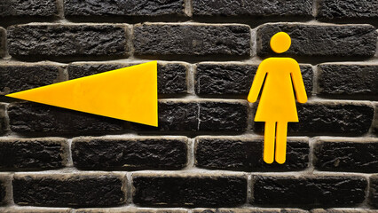 yellow  signs on brick wall