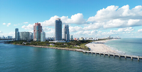 Miami Beach cityscape. Miami summer aerial view. Miami Beach shoreline. South Beach Miami aerial view. Blue ocean in Florida skyline. Miamis cityscape. Ocean coast. Summer skyscraper skyline.